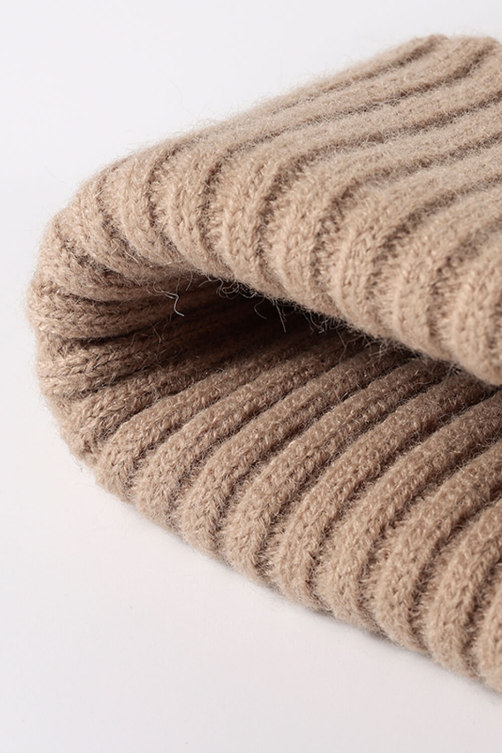 Beige ribbed acrylic beanie with a soft texture.