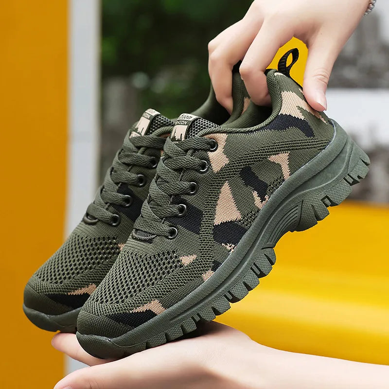 Camouflage mesh performance trainers in moss green with lace-up closure and athletic sole.