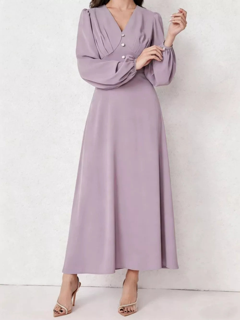 Lavender ruched maxi dress with V-neck, decorative buttons, and balloon sleeves.
