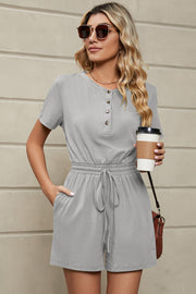 Light gray casual Henley romper with short sleeves, button front, drawstring waist, and pockets.