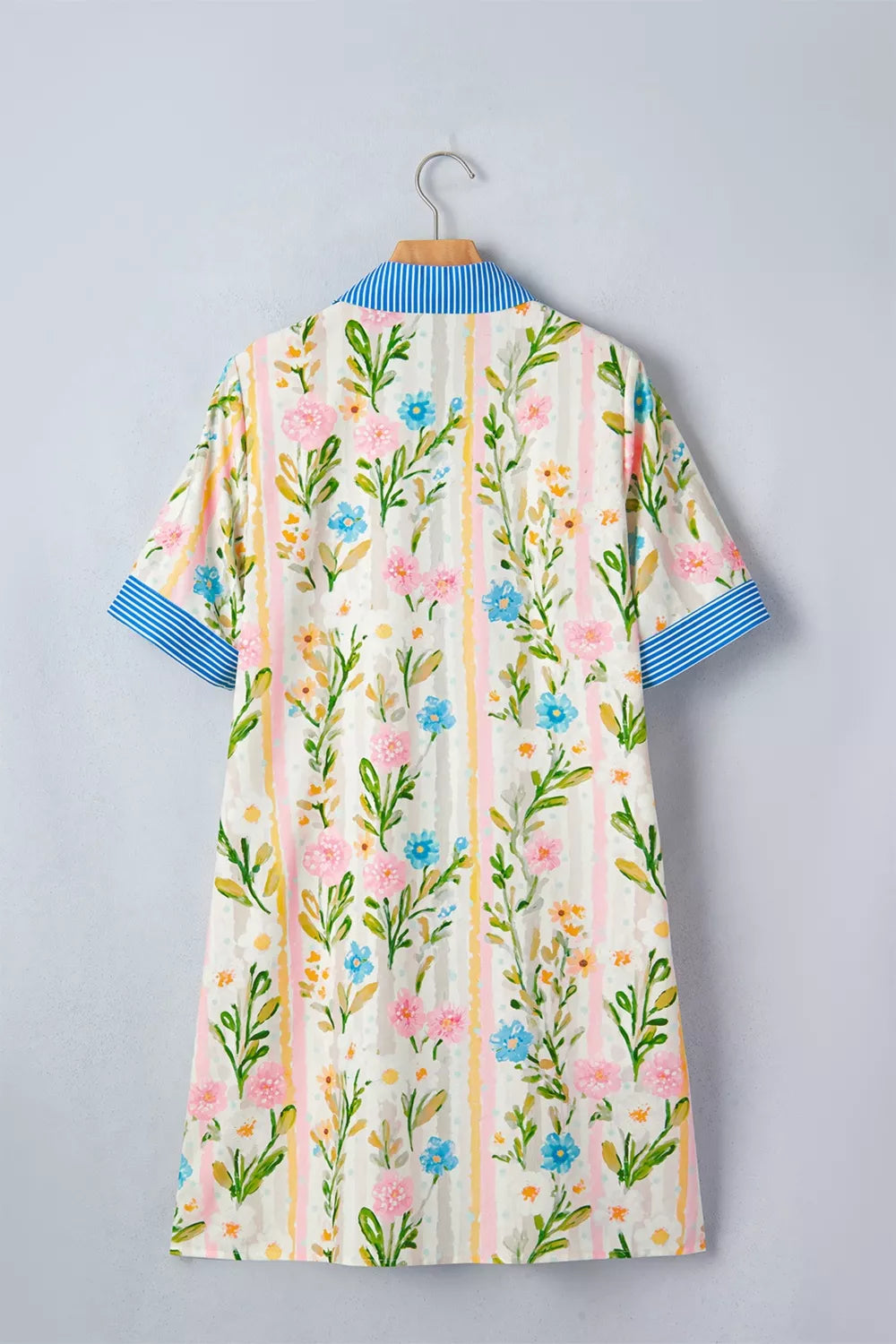 Floral print shift dress with blue striped collar and cuffs.