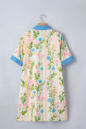 Floral print shift dress with blue striped collar and cuffs.