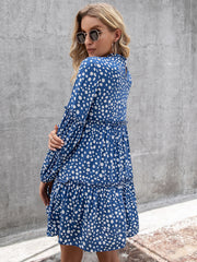 Cerulean polka dot mini dress with ruffle yoke and tiered skirt.