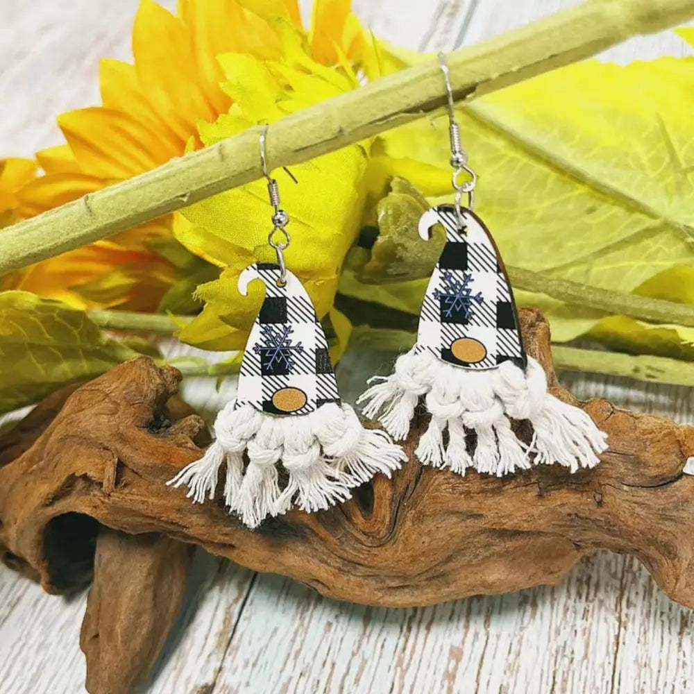 Gnome hat macrame drop earrings with black and white buffalo plaid and snowflake detail.