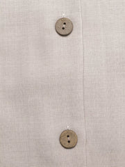 Midi dress in light beige with button-down front and natural wood buttons.