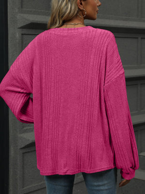 Textured ribbed v-neck blouse in deep rose with blouson sleeves
