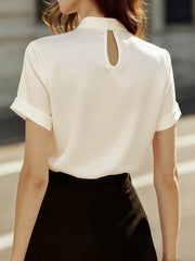 Cream satin blouse with short rolled sleeves and a keyhole neckline detail.