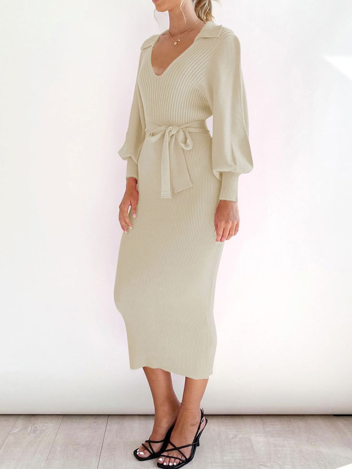 Cream ribbed knit midi dress with collar, V-neck, tie waist, and balloon sleeves.
