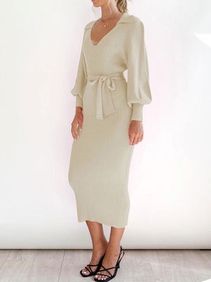 Cream ribbed knit midi dress with collar, V-neck, tie waist, and balloon sleeves.