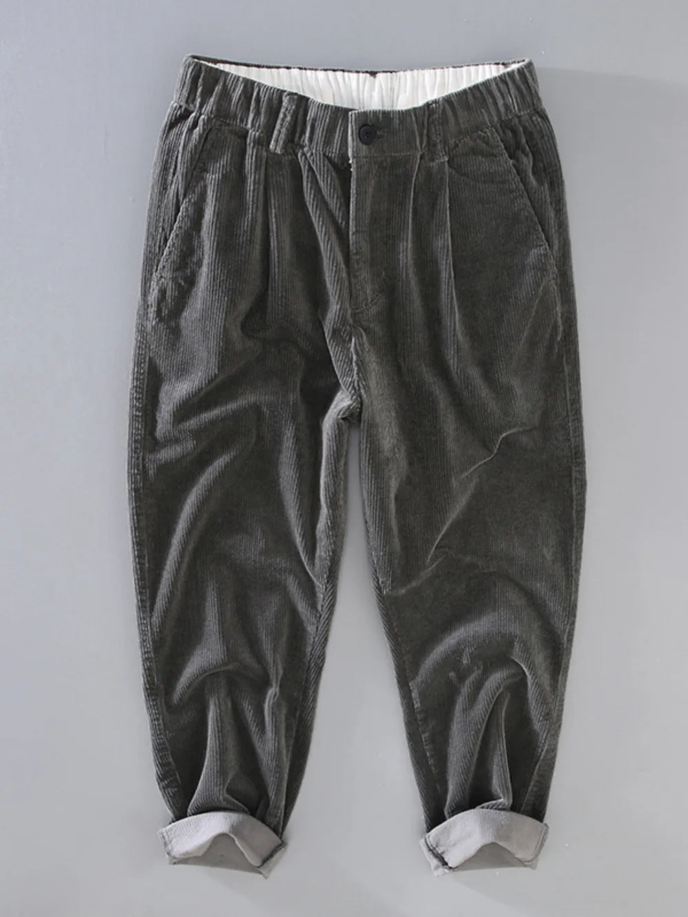 Smoky gray corduroy pleated casual pants with elastic waistband and cuffed hem.