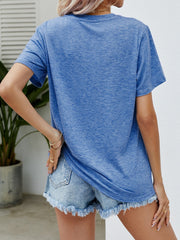 Cobalt blue heather t-shirt with short sleeves and a crew neck, styled with denim shorts.