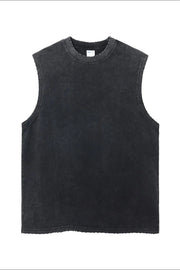 Acid wash muscle tank top in dark gray with raw hem and distressed neckline.