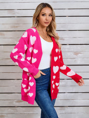 Heartbeat split-panel open cardigan in pink and red with white hearts, acrylic blend, with pockets.