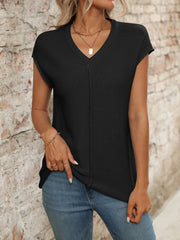 Black seamed knit sleeveless v-neck top with a casual fit.