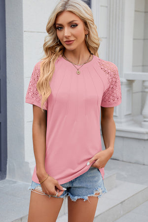 Blush pink ribbed tee with lace raglan sleeves and pintuck detail on the front.