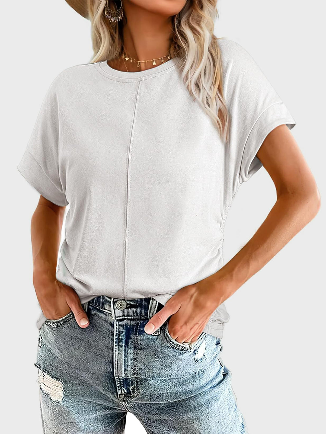 White seamed front ruched sleeve tee with crew neck and cuffed short sleeves.