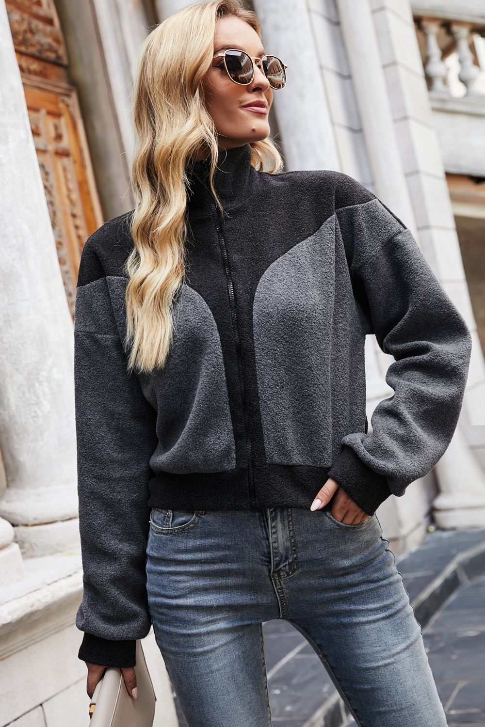Colorblock fleece bomber jacket in dark gray with a zip front and mock neck.