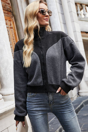 Colorblock fleece bomber jacket in dark gray with a zip front and mock neck.