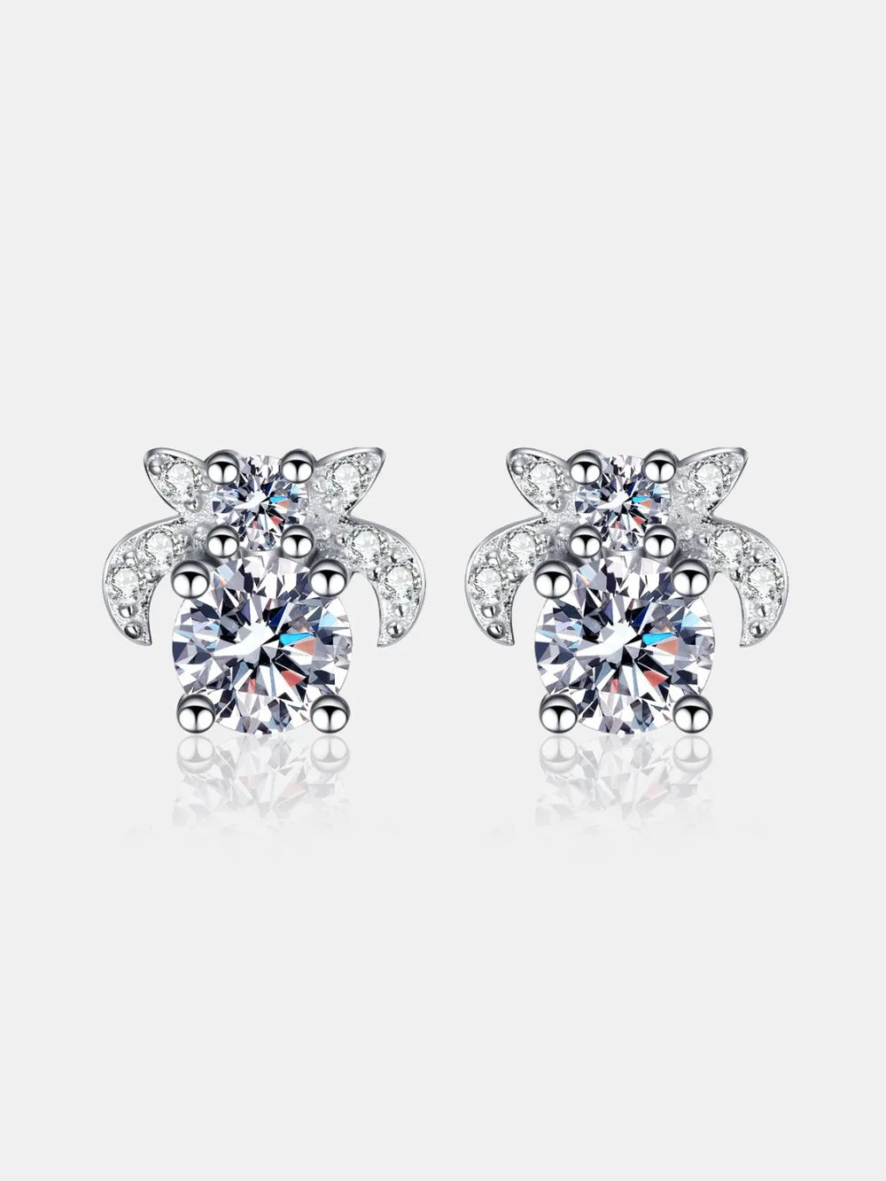 Silver moissanite floral cluster stud earrings with sparkling accents.