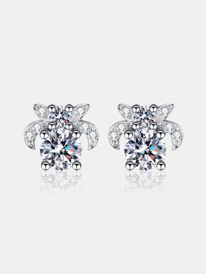 Silver moissanite floral cluster stud earrings with sparkling accents.