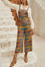 Floral patchwork culotte jumpsuit with square neckline and wide legs.