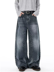 Men's vintage-inspired wide-leg jeans in dark wash denim with a black belt.