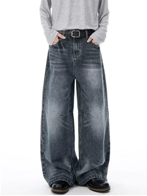 Men's vintage-inspired wide-leg jeans in dark wash denim with a black belt.
