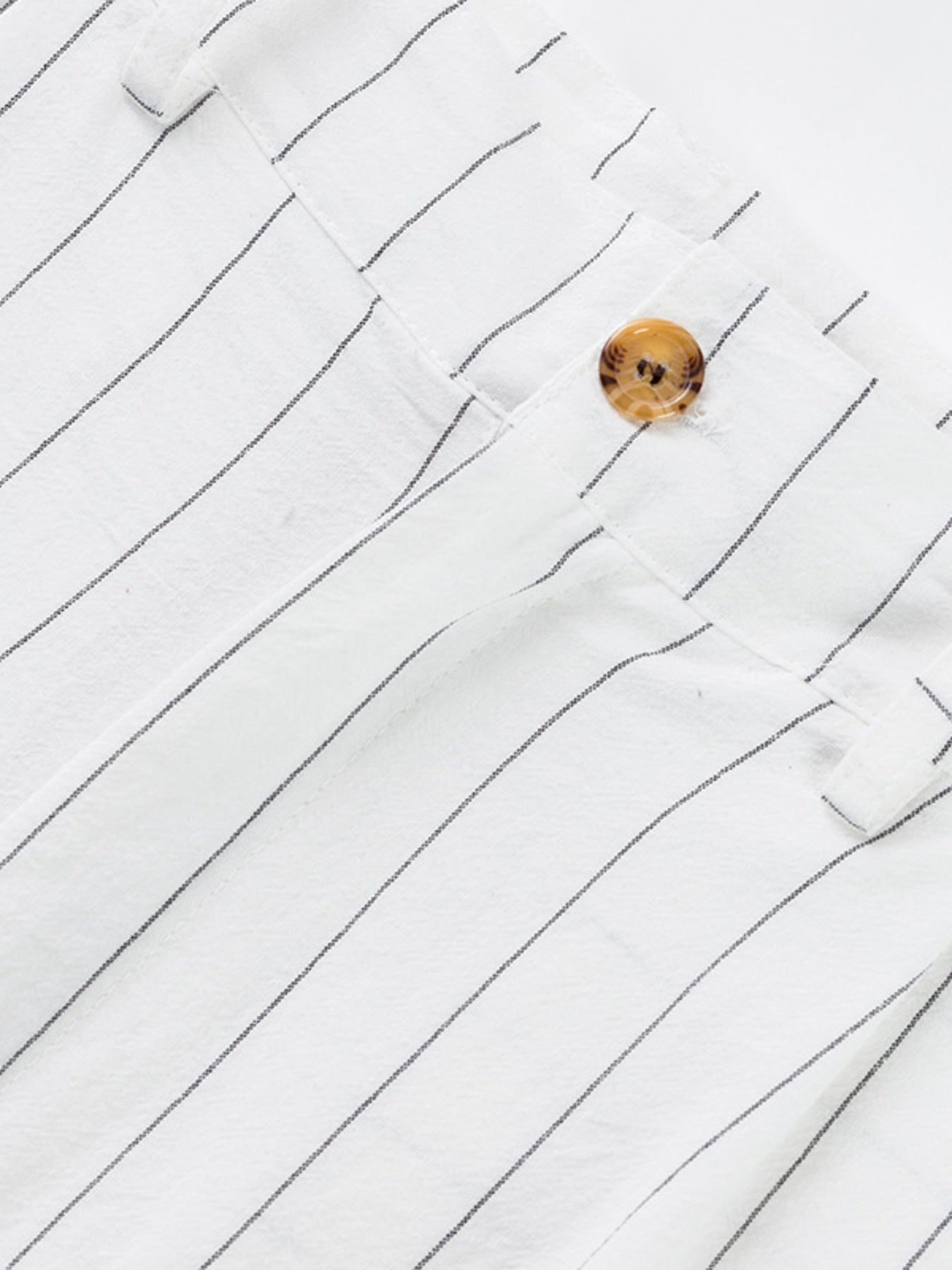 White striped sweatpants with a button detail