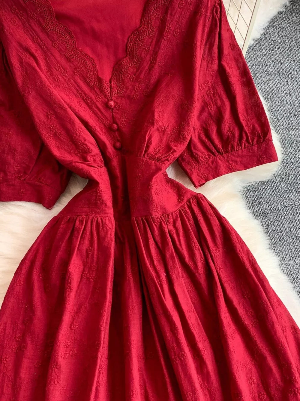 Crimson lace-embellished A-line midi dress with V-neck and button detail