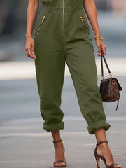 Green zip-up romper with collared neckline and cuffed hem pants.