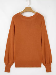 Caramel acrylic blend drop shoulder sweater with balloon sleeves and ribbed cuffs.