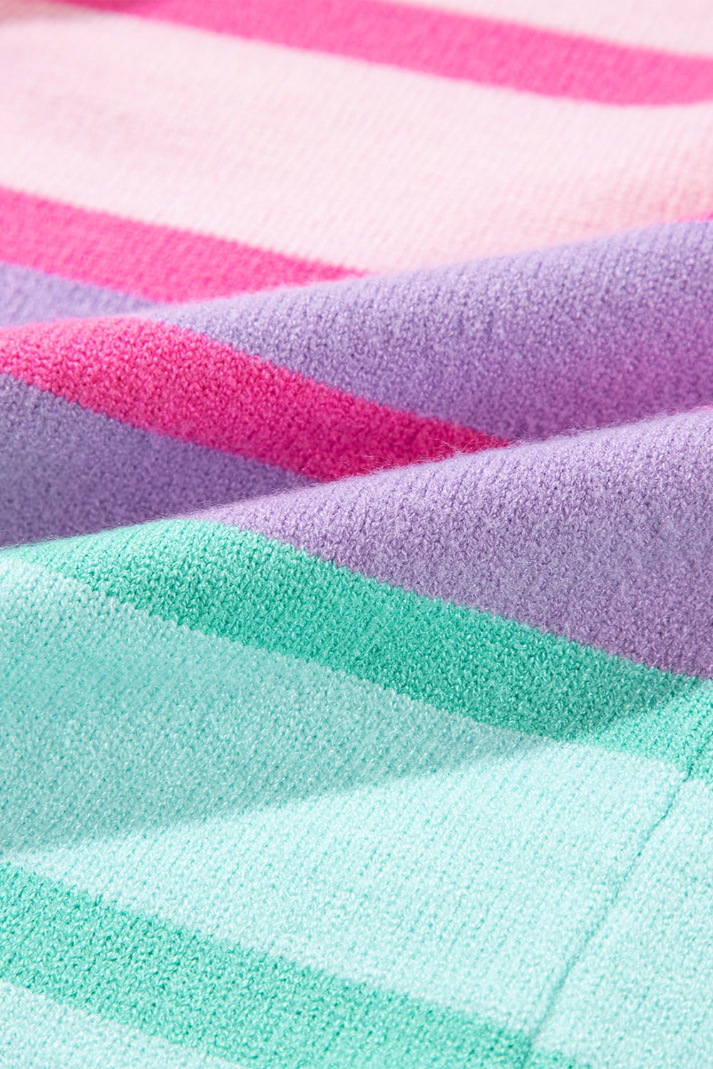 Ombre stripe knit sweater in sherbet and turquoise with ribbed cuffs.