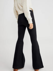 Black flare denim jeans with a high waist and frayed hem detail.