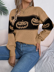 Camel intarsia knit sweater with black jack-o'-lantern pattern, crew neck, long sleeves.