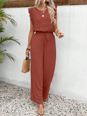 Terracotta textured jumpsuit with ruffle sleeves and drawstring waist