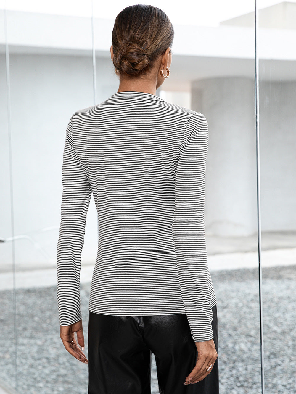 Ribbed Henley stripe top in gray with buttoned neckline and long sleeves.