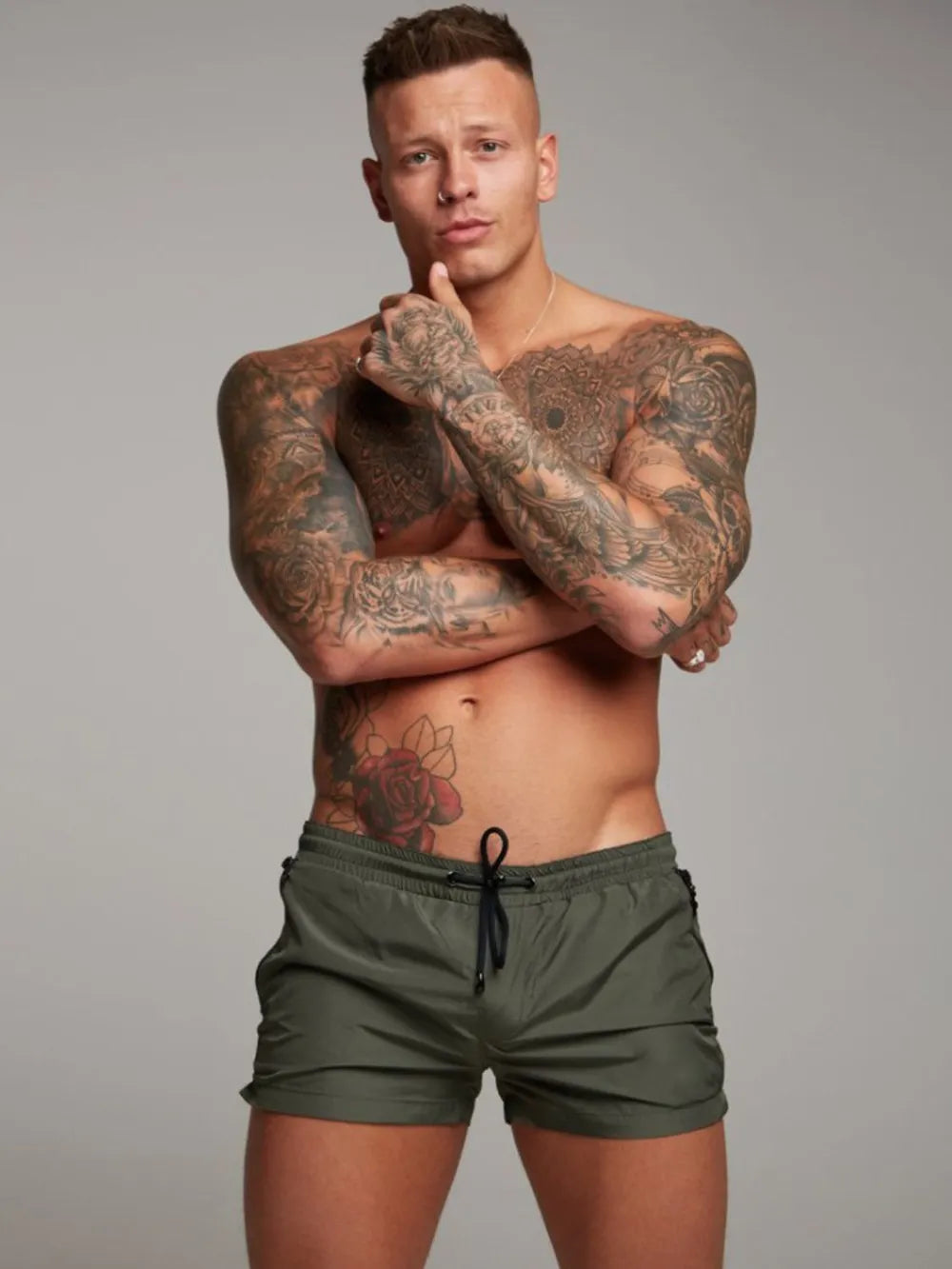 Green boardshorts with drawstring and zip pockets