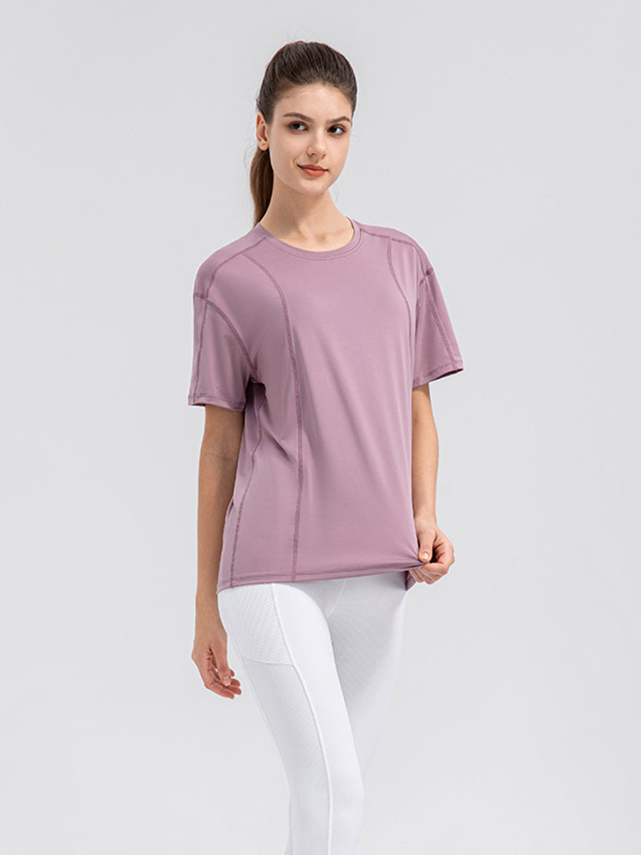 Dusty Pink performance tee with seam details and crew neck.