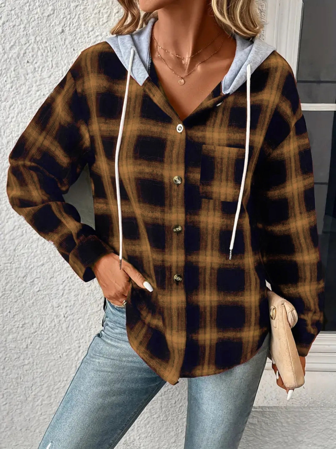 Plaid shirt jacket with contrast hood in tan and black, featuring button front and chest pocket.