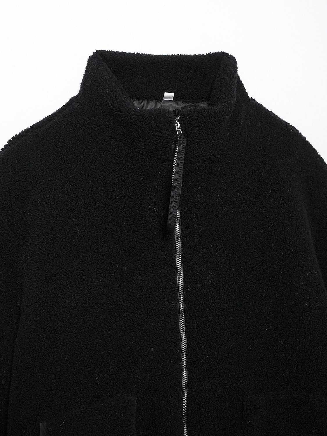 Black sherpa jacket with stand collar and full zip closure.