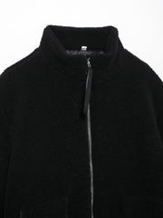 Black sherpa jacket with stand collar and full zip closure.