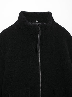 Black sherpa jacket with stand collar and full zip closure.