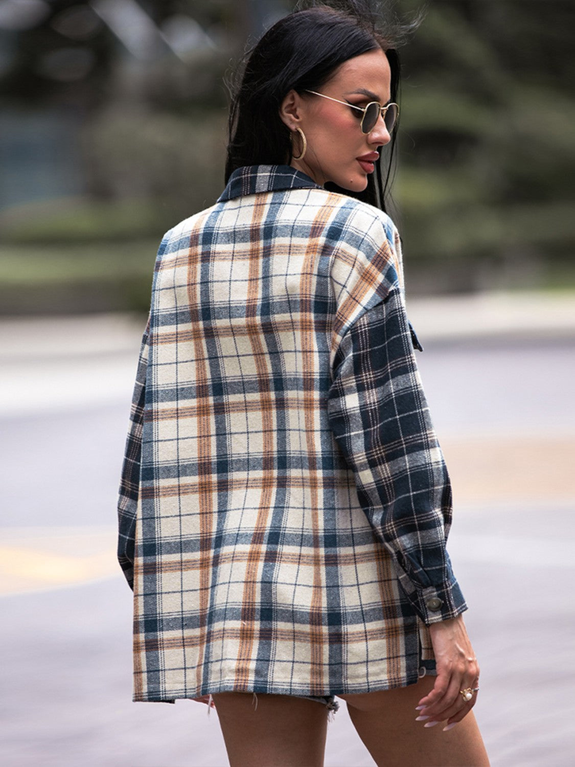 Colorblock plaid utility shacket in navy with a relaxed fit and button cuffs.