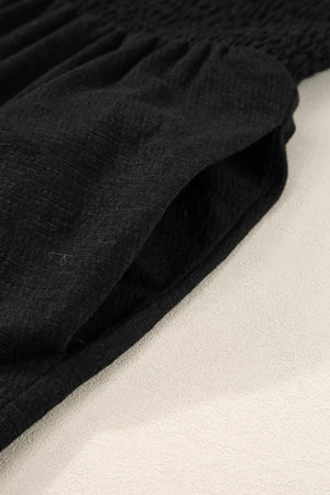 Black textured ribbed waist jumpsuit with a pocket detail