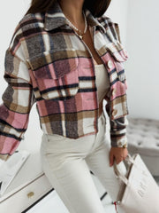 Cropped pink plaid shacket with oversized chest pockets and collared neckline.
