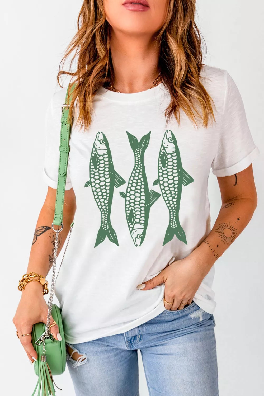White cotton crew neck t-shirt with a green fish graphic print.