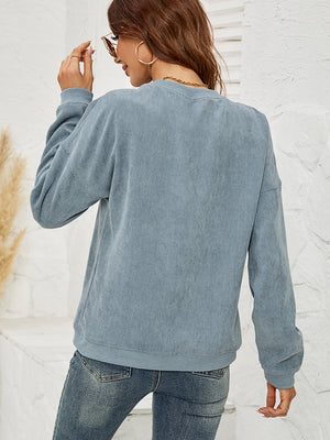 French Blue corduroy sweatshirt with crew neck and long sleeves.