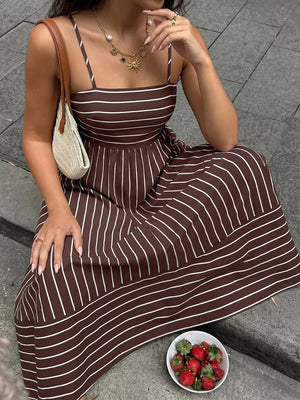 Brown striped maxi dress with smocked detail and cutout, square neck, spaghetti straps.