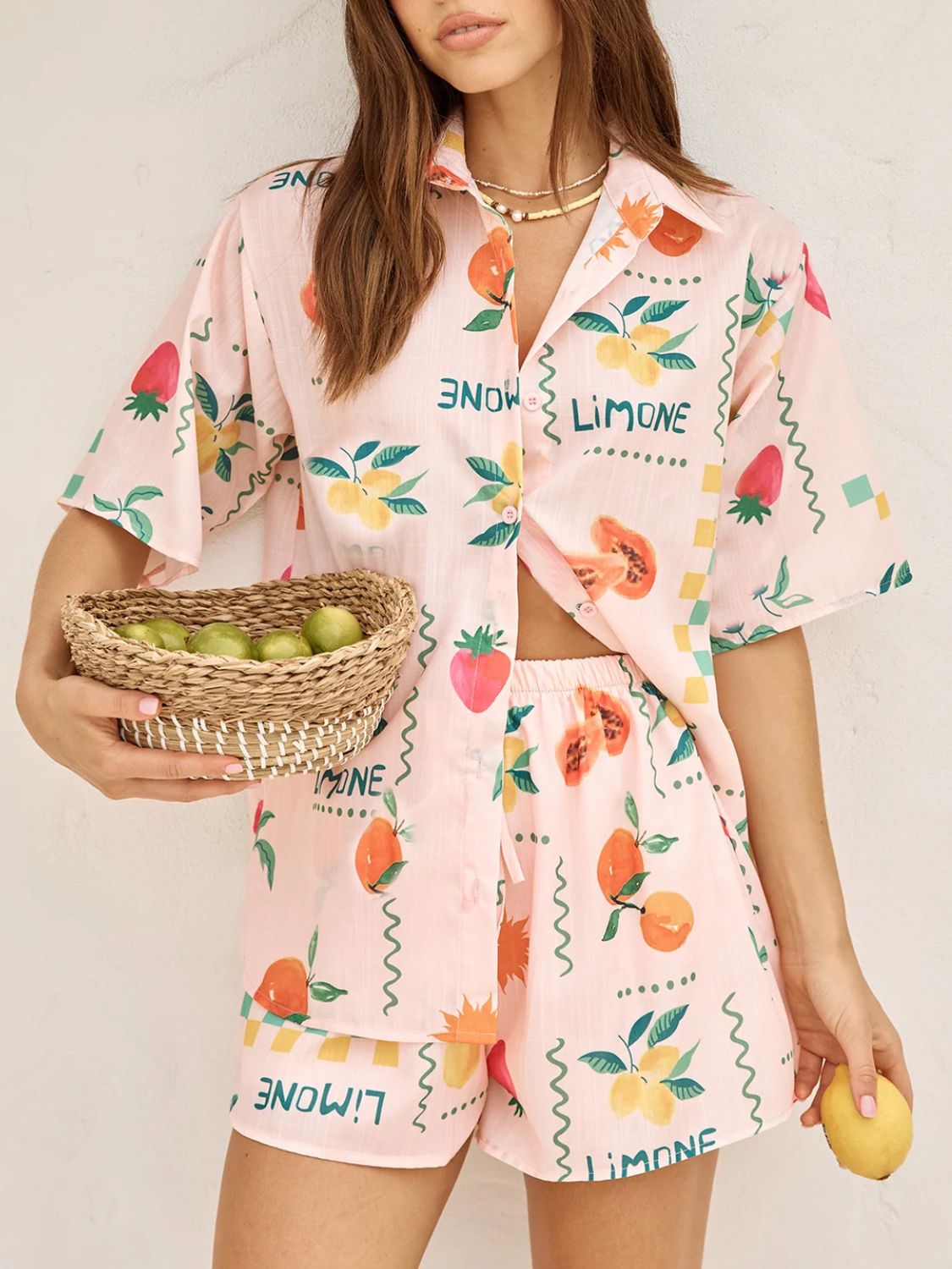 Pink co-ord pajama set with limoncello fruit print, button-down shirt and shorts