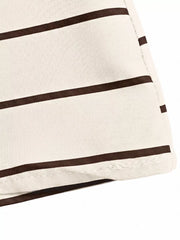 Patterned maxi dress with brown stripes and smocked detail.